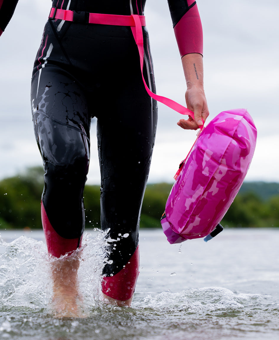 HUUB open-water tow float side view showing camo print and inflatable buoy profile
