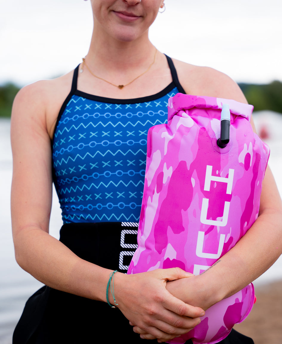 HUUB Safety Tow Float product detail with strap, whistle, and Pink Camo swim buoy finish